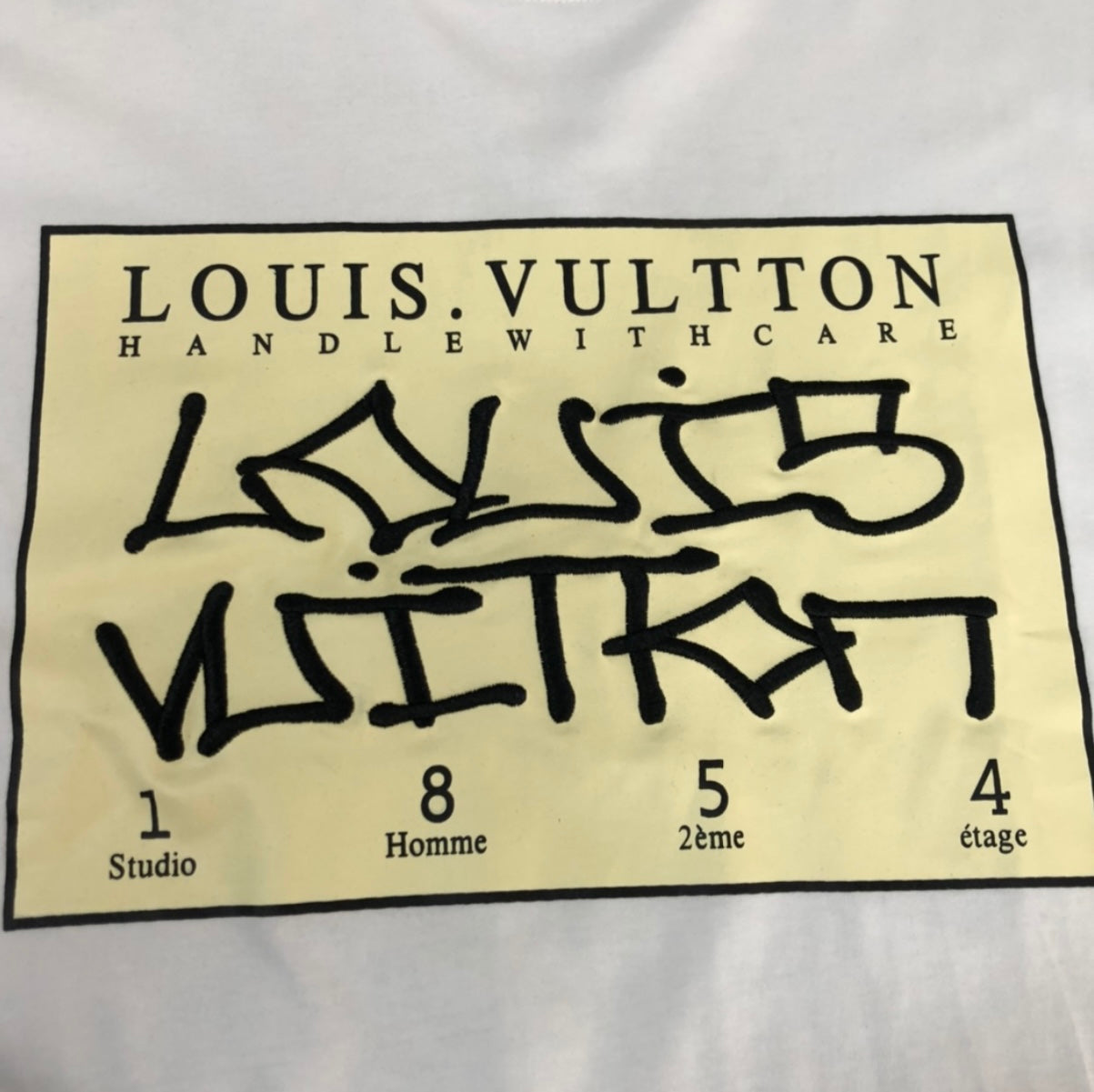 Louis Vuitton “HANDLE WITH CARE” WHITE