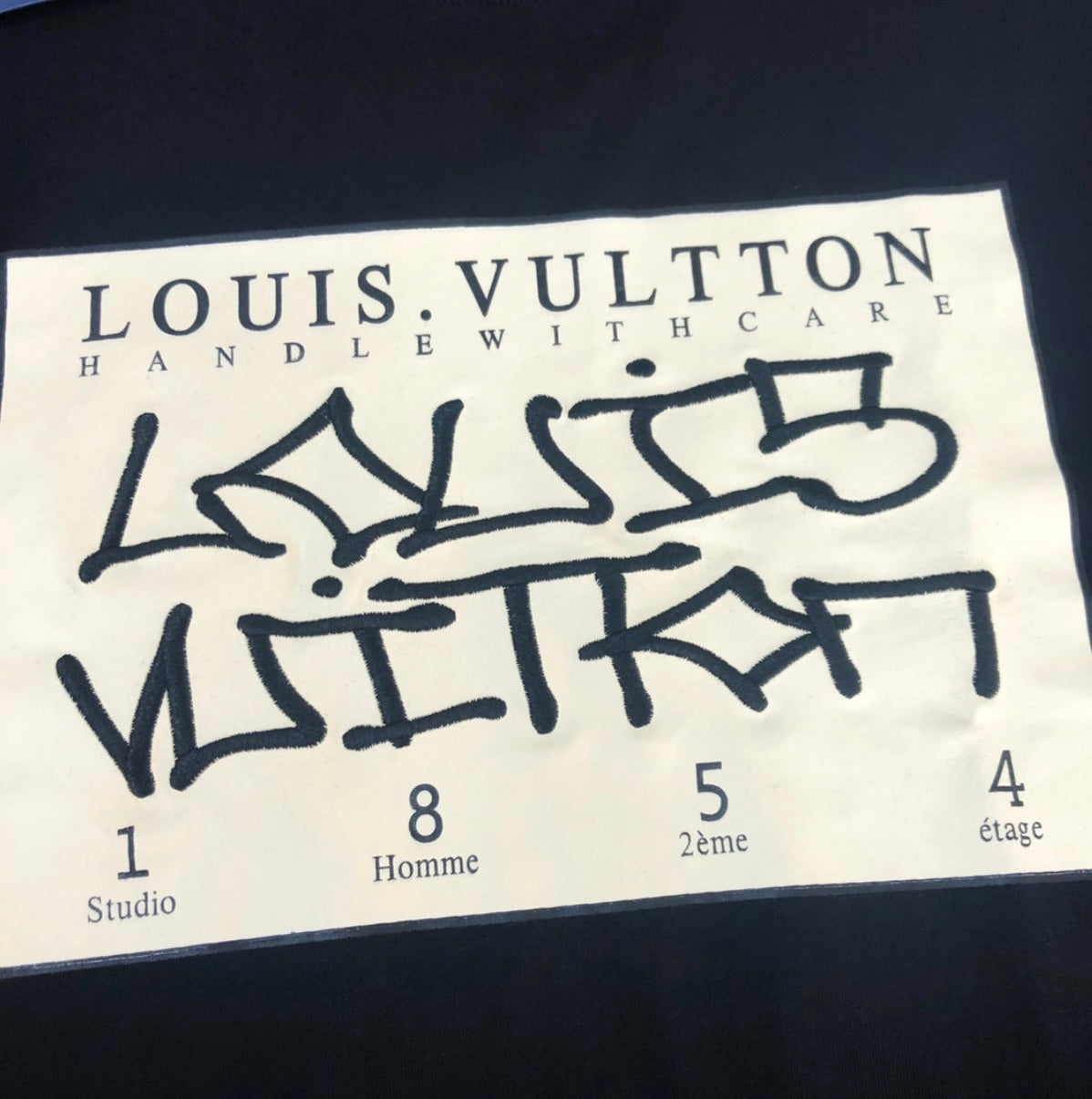 Louis Vuitton “HANDLE WITH CARE” WHITE